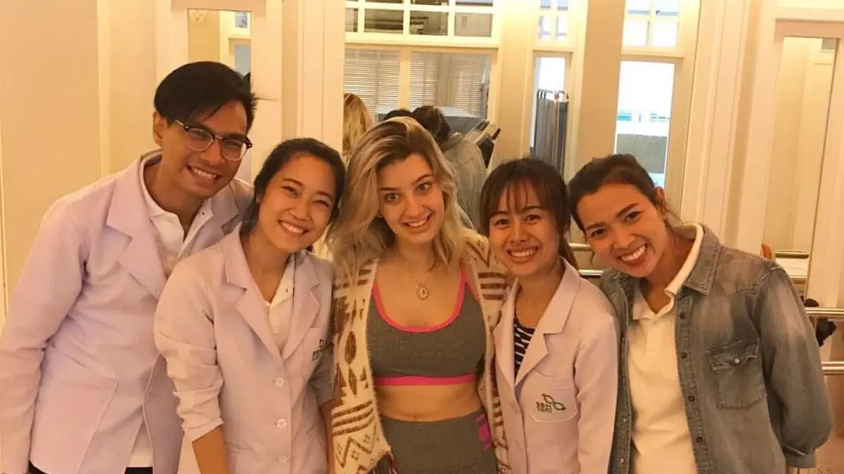 Lorena with staff undergoing ataxia stem cell treatment in Thailand